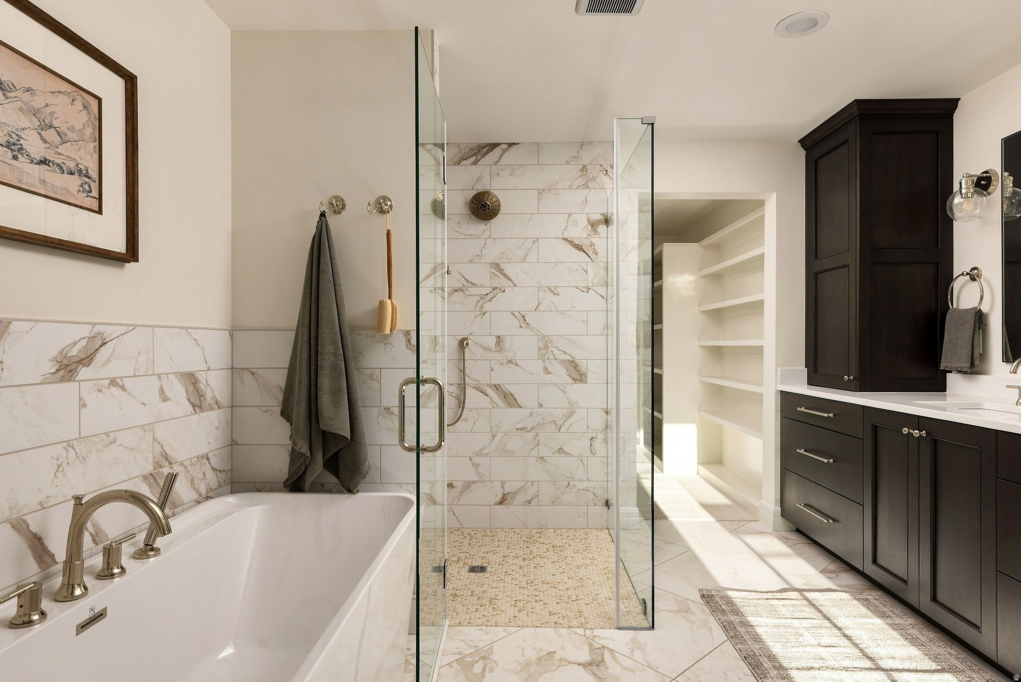 Contemporary bathroom featuring a freestanding tub, glass-enclosed shower with tile surround, dark wood-finish cabinetry, and built-in shelving